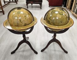 A pair of Terrestrial & Celestial library globes